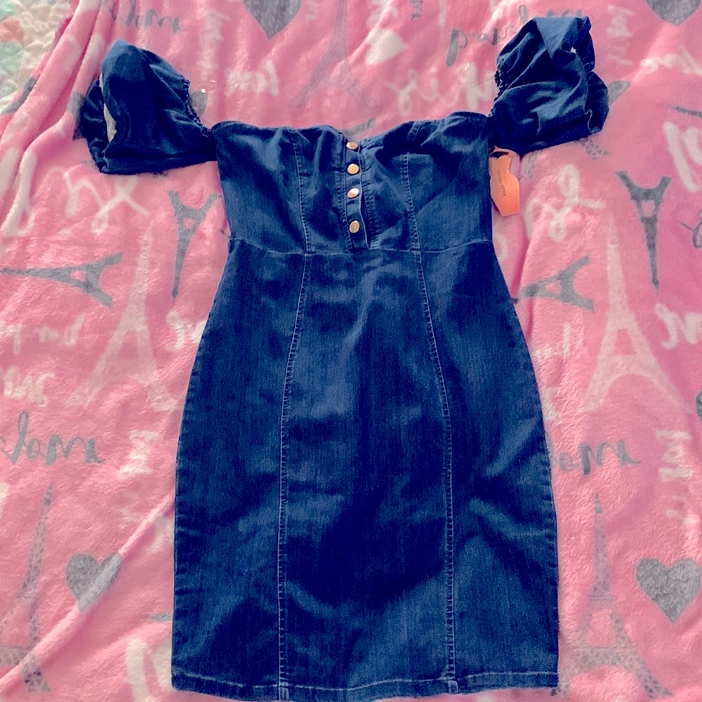 Medium denim dark wash jean dress.